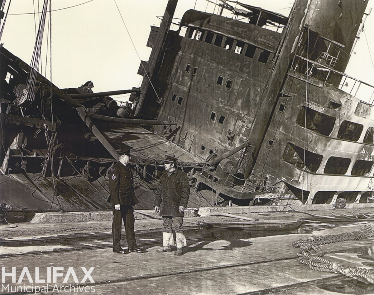 1970ca - ship fire at the Halifax waterfront. Captain Tom Abraham is pictured in uniform-HRM Archives, Halifax Fire Department-102-111-4-5.2